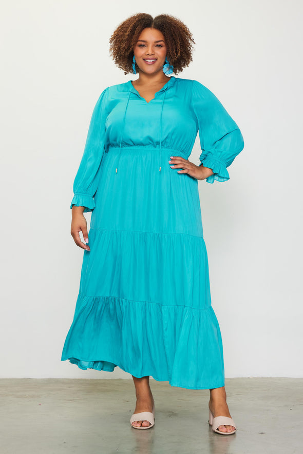 Front view of the pretty in teal maxi. A long sleeve tiered dress with a ruched waist 