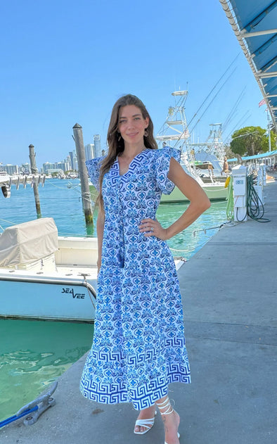 Model in a marina in the Islapayal Amalfi Maxi Dress - Hellenic Blue