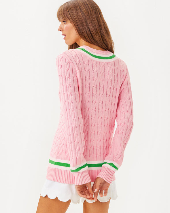 Back view of the Lilly Pulitzer Brockton Sweater. A light pink varsity style sweater with green accent stripes around the v neck collar, wrists, and bottom hem