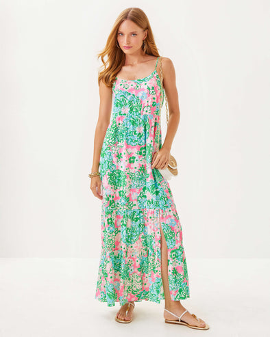 Model in the Lilly Pulitzer Teresa Maxi Dress - Multi - Plumes In Bloom. A tiered maxi dress with a knee high slit and spaghetti straps