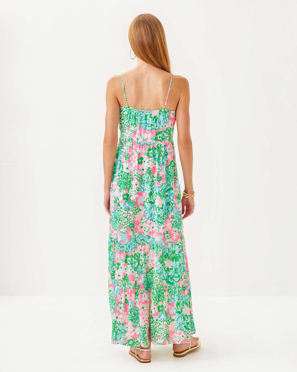 Back view of model in the Lilly Pulitzer Teresa Maxi Dress - Multi - Plumes In Bloom. A tiered maxi dress with a knee high slit and spaghetti straps