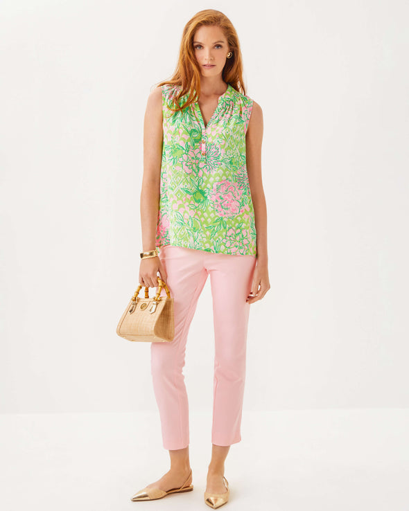 Full body view of the Lilly Pulitzer Sleeveless Elsa Top - Fauna Green - Lime Feeling Good. A sleeveless top with green and pink floral pattern, with ruching at the neck. 