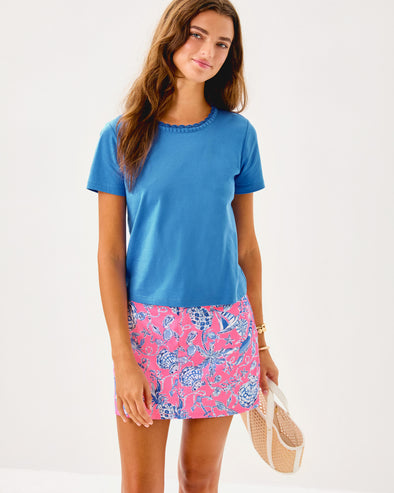 Smiling model in the Lilly Pulitzer Colette Mini Skort - Rousseau Pink Barefoot Beachcomber