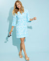 Playful model in the Jude Connally Megan Dress - Painted Tile Aqua