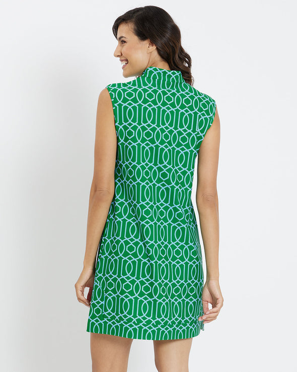 Back of a woman wearing green dress looking to the side