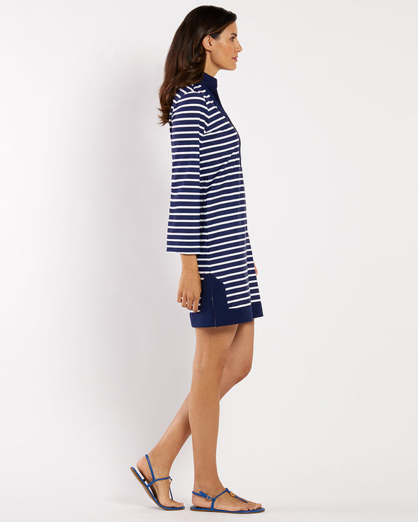 Woman wearing a blue and white striped dress on a white background