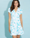 Front view of a smiling brunette model in the Jude Connally Ginger Dress - Birds And Butterflies White