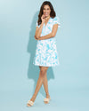 Smiling model in the Jude Connally Ginger Dress - Birds And Butterflies White