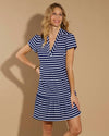Smiling model in a mini length navy and white stripe v neck dress with short sleeves