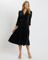 Model wearing Jude Connally Maggie Velvet Midi Dress in Black on white background