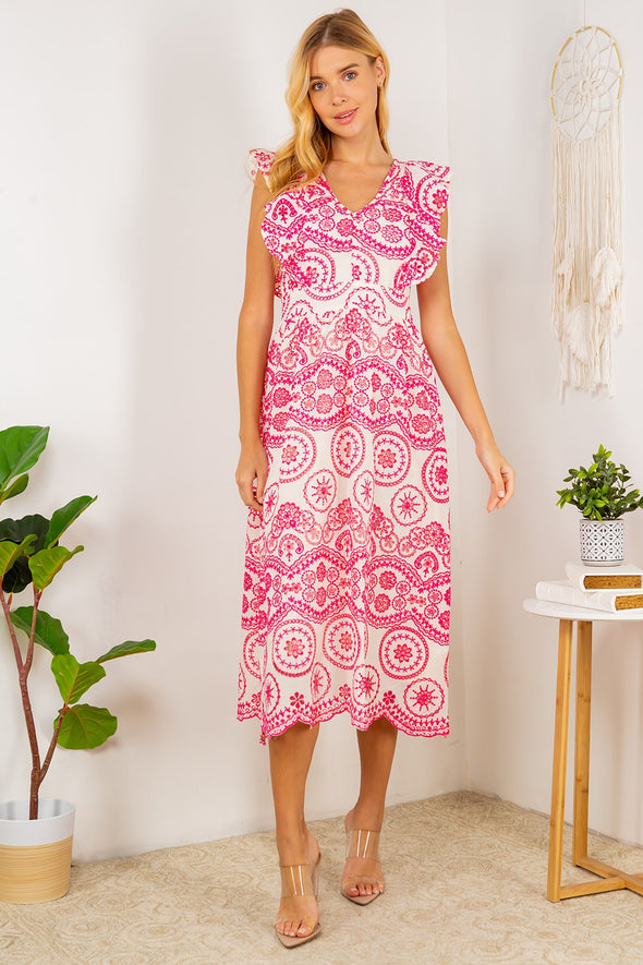 Full body view of the Tisbury Eyelet Midi Dress. A midi length dress with pink eyelet detailing, and puff sleeves