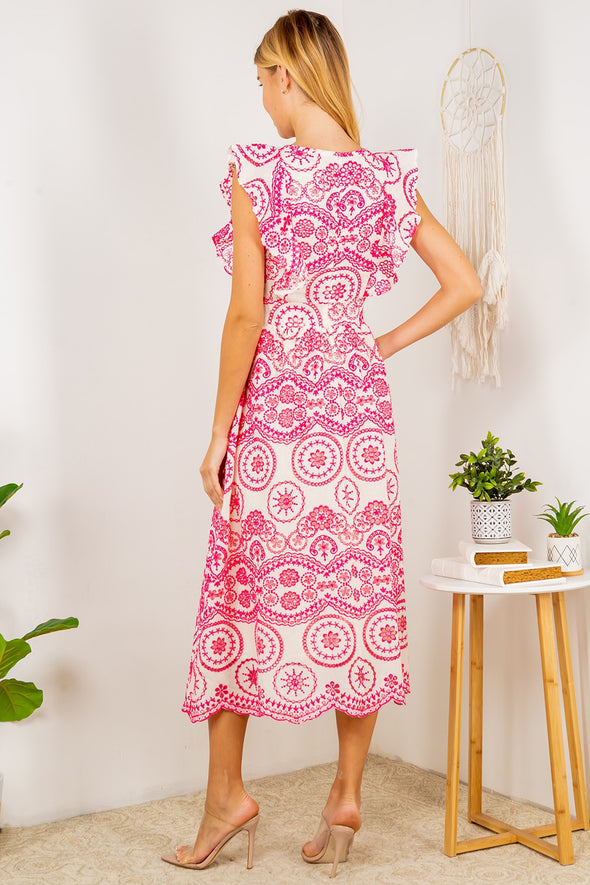 Back view of the Tisbury Eyelet Midi Dress. A midi length dress with pink eyelet detailing, and puff sleeves