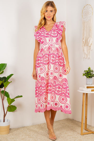 Full body view of the Tisbury Eyelet Midi Dress. A midi length dress with pink eyelet detailing, and puff sleeves