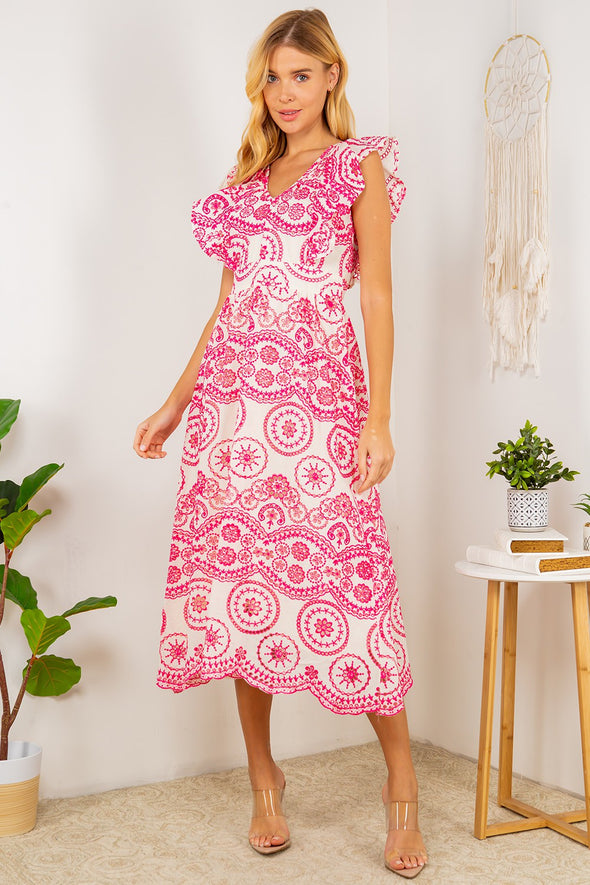 Full body view of the Tisbury Eyelet Midi Dress. A midi length dress with pink eyelet detailing, and puff sleeves