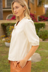 Side view of Sloane Puff Sleeve top in cream