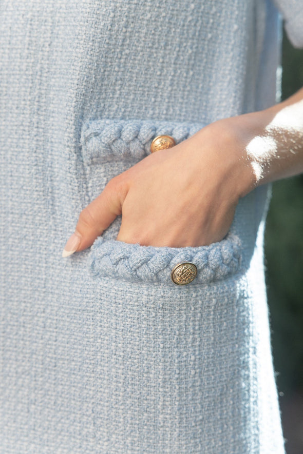 Model showing the pocket of the Kennedy Tweed Dress in Ice Blue