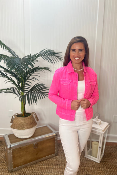 Model wearing hot pink linen jacket with frayed hems