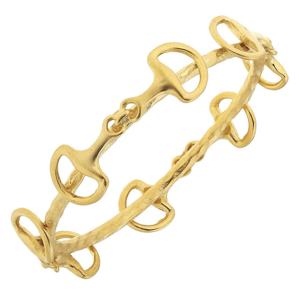 Gold bracelet with intricate design on a white background