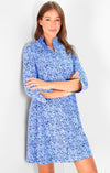 Model with arms crossed Duffield Lane Oaklee Dress - Blue Bouquet. 