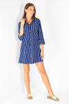 Full body view of model in the Duffield Lane Oaklee Dress - Navy/ White Stripe