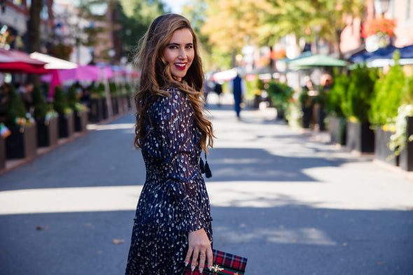 Model In the Sail to Sable Smocked Midi Dress - Navy Clip Dot