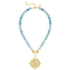 A flat view of the Susan Shaw Nellie Bee Necklace. Blue beads with a gold bee pendant