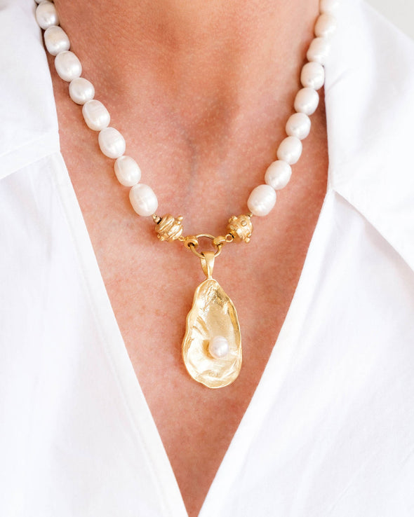 Model in the Susan Shaw Pearl Oyster Necklace with Gold Oyster and Freshwater Pearl