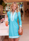 Smiling model with a drink in hand in the Cabana Life Amalfi Coast Long Sleeve Tunic Dress