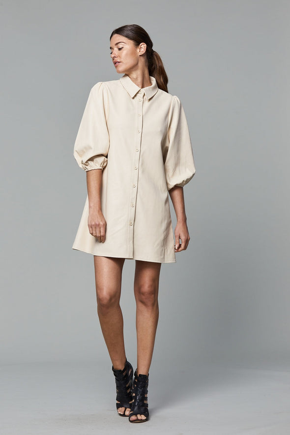Full view of model wearing the Dolce Cabo Soft Vegan Leather Dress in Creme