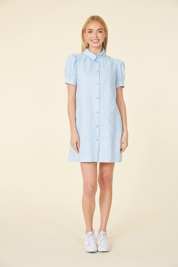 Full body view of short light blue dress, with buttons up the front, and puff sleeves