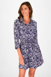 Smiling model in the  Duffield Lane Camila Dress in Navy Blossoms