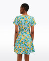 Back view of model in the Draper James Mae Love Circle Dress - Lemon Blossom