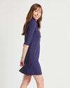 Side view of model in the Jude Connally Sloane Dress - Navy