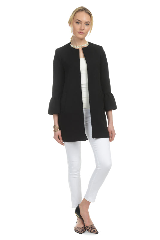 Model wearing Patty Kim Kelly Gathered Ruffle Sleeve Jacket in Black with White Jeans
