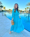 Model by pool wearing Teal Maxi Dress with Tiered skirt and 3/4 Sleeves