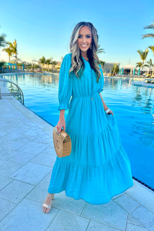 Model by pool wearing Teal Maxi Dress with Tiered skirt and 3/4 Sleeves