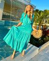 Front View of Model by Pool Wearing Teal Maxi Dress with Tiered skirt and 3/4 Sleeves