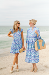 2 models on the beach, one in the Sail To Sable Poppy Ruffle Neck Dress 