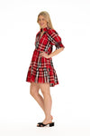 Side view of model in red plaid tartan puff sleeve dress