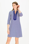 Smiling model looking away from camera in the Duffield Lane Spring Lake Anniversary Dress - Thin Navy Stripe