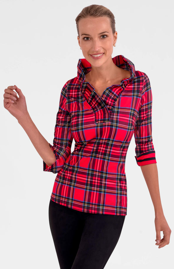 Blonde woman wearing a red and black plaid shirt on a white background