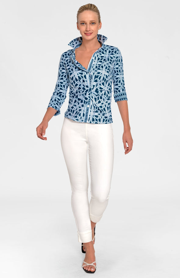 Full body view of model in Gretchen Scott Twist & Shout Top - Ring Toss - Navy paired with white pants and white open toe sandals