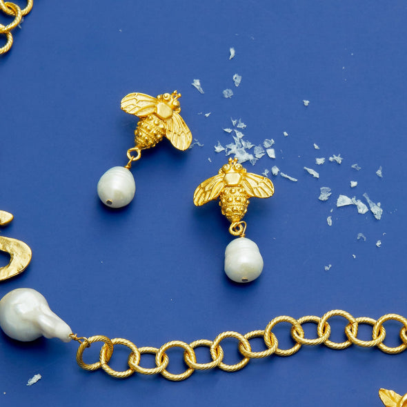 Flat view of the Susan Shaw Handcast Bee + Pearl Drop Earrings