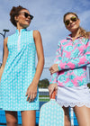 Models on a pickleball court in the Cabana Life Cote D` Azur Sleeveless Performance Zip Dress