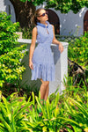Model outside in a garden wearing Gretchen Scott Hope Dress in Periwinkle