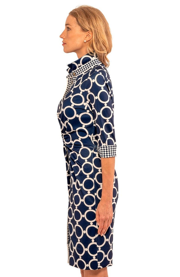 Side view of model wearing Gretchen Scott Twist And Shout Dress in Dip & Dots Navy/White