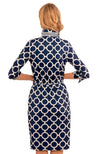Back view of model wearing Gretchen Scott Twist And Shout Dress in Dip & Dots Navy/White