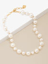 Zenzii Mixed Pearl Collar Necklace flat on two-tone display case