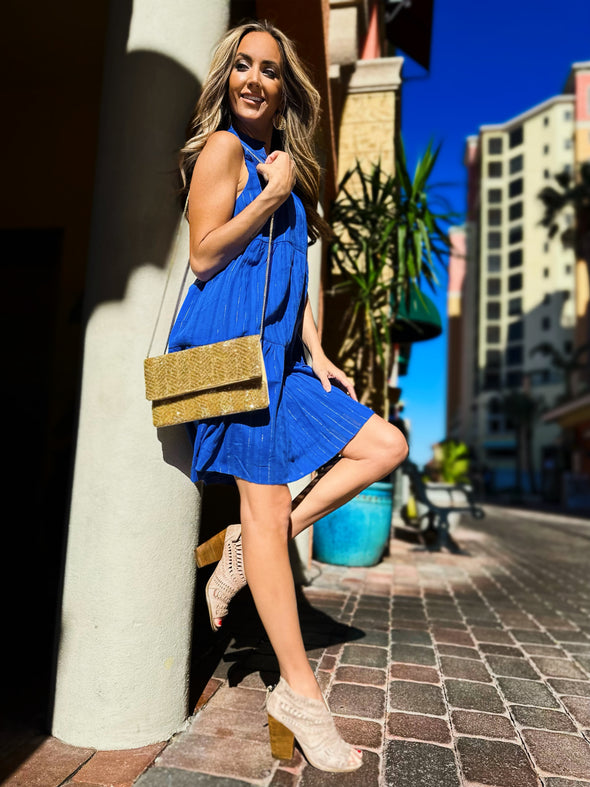 Outdoor side view of Duffield Lane x Lucky Knot Exclusive Annika Dress- Bright Blue Metallic Stripe