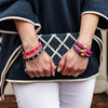 Model in the Delia Enamel Nautical Ship's Wheel Hinge Bangle - Navy